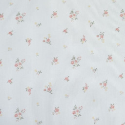 Tissu jersey côtelé motif fleurs roses fond blanc cassé