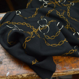 Tissu Jersey milano motif chaines dorés fond noir