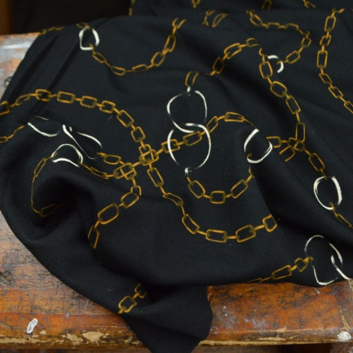 Tissu Jersey milano motif chaines dorés fond noir