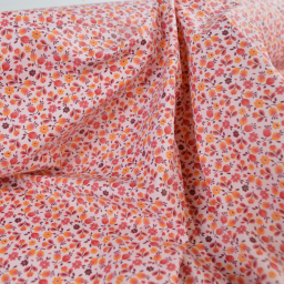 Tissu imperméable Caseille type ciré de pluie motif fleurs fond rose