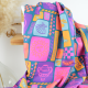 Tissu popeline de coton Poppy – motif patchwork d'été fond pétrole