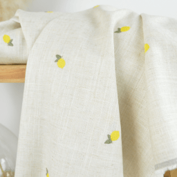 Tissu viscose lin brodé citrons jaunes - fond sable