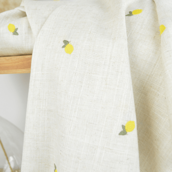 Tissu viscose lin brodé citrons jaunes - fond sable