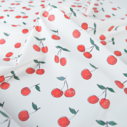 Tissu imperméable type ciré motif cerises fond blanc