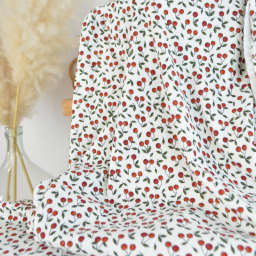 Tissu jersey côtelé motif cerises fond blanc cassé