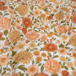 Tissu double gaze de coton Elisabeth motif fleurs tons orangés et rose