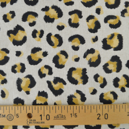 Tissu demi natté coton motif léopard doré fond aspect lin