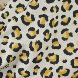 Tissu demi natté coton motif léopard doré fond aspect lin