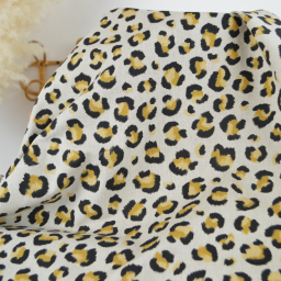 Tissu demi natté coton motif léopard doré fond aspect lin