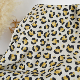 Tissu demi natté coton motif léopard doré fond aspect lin