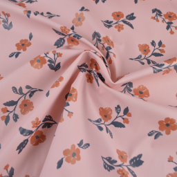 1 coupon de 45 cm de Tissu imperméable Alina type ciré de pluie motif fleurs fond Nude
