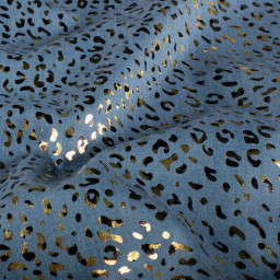 Tissu Jean fin motif Léopard doré fond bleu
