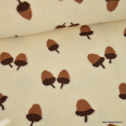 Tissu sherpa écru motif glands camel et chocolat