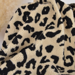 Tissu sherpa motif léopard fond écru