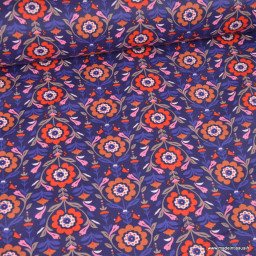 Tissu coton enduit Reine motif fleurs rouges fond bleu