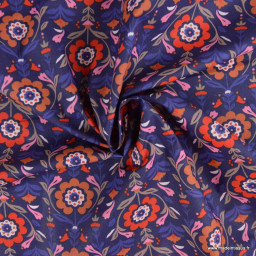 Tissu coton enduit Reine motif fleurs rouges fond bleu