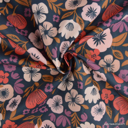 Tissu coton enduit Palawa motif fleurs skin fond bleu