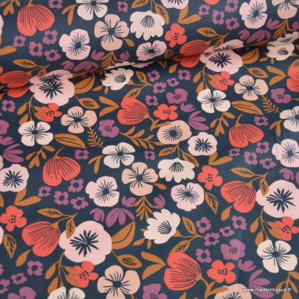 Tissu coton enduit Palawa motif fleurs skin fond bleu