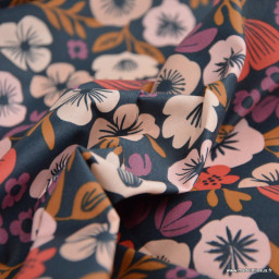 Tissu coton enduit Palawa motif fleurs skin fond bleu