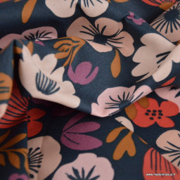 Tissu coton enduit Palawa motif fleurs skin fond bleu