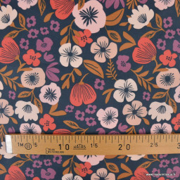 Tissu coton enduit Palawa motif fleurs skin fond bleu