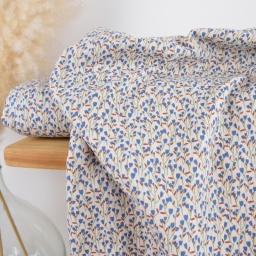 Tissu double gaze de coton Diletta motif fleurs bleues fond latté