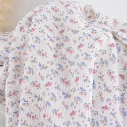 Tissu double gaze de coton Marthe motif fleurs fond blanc cassé