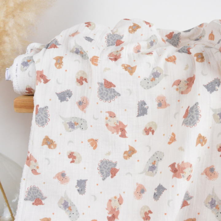 Tissu Double gaze Dinofamily motif dinosaures fond écru - OEKO TEX