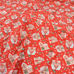 Tissu cretonne coton de Noël Glaçage motif maisons fond rouges - Okeo tex
