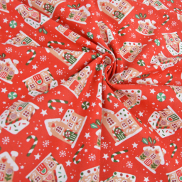 Tissu cretonne coton de Noël Glaçage motif maisons fond rouges - Okeo tex