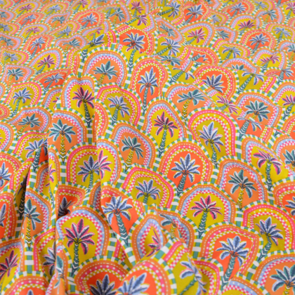 Tissu cretonne coton Amaya motif palmiers graphiques jaune safran et orange