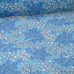 Crêpe plissé motifs fleurs fond bleu