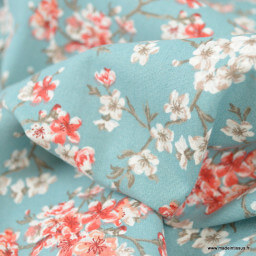 Tissu enduit coton Mume motifs fleurs japonaises Sakura fond bleu