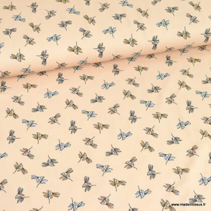 Tissu jersey motifs feuilles fond beige - oeko tex