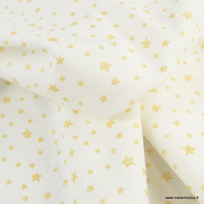 Tissu coton imprimé dessin étoiles or sur fond blanc