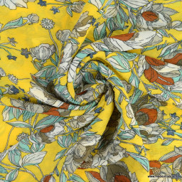 Tissu crêpe froissé motifs fleurs fond moutarde