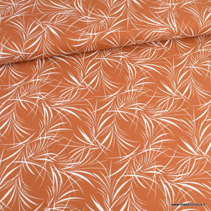 Tissu Viscose lin motifs feuilles exotiques fond brique