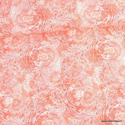 Tissu Viscose motif empreintes fond corail