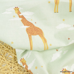 Tissu cretonne coton Zefira motif girafes fond menthe -  oeko tex