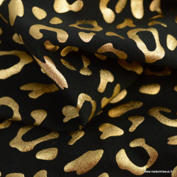 Tissu jersey noir motif léopard glitter doré