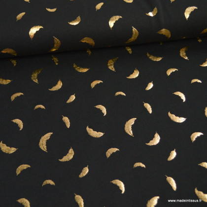 Tissu jersey noir motif plumes dorées