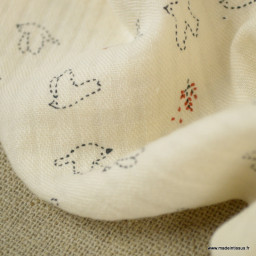 Tissu coton gaufré seersucker motifs hirondelles fond vanille