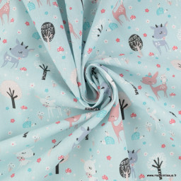 Tissu coton Bambi motif daims dans la foret fond bleu