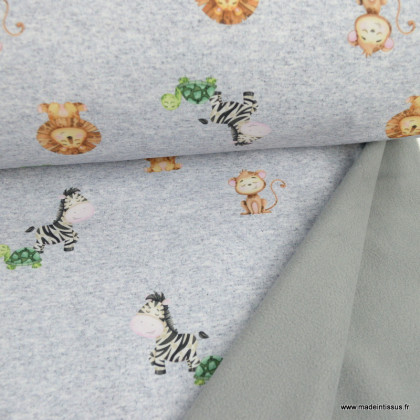Tissu Softshell motifs animaux de la savane eèbres et lions fond gris chiné