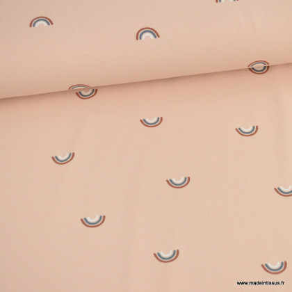 Tissu jersey motif arc en ciel fond rose - Oeko tex standard 100