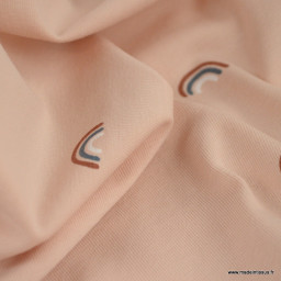 Tissu jersey motif arc en ciel fond rose - Oeko tex standard 100