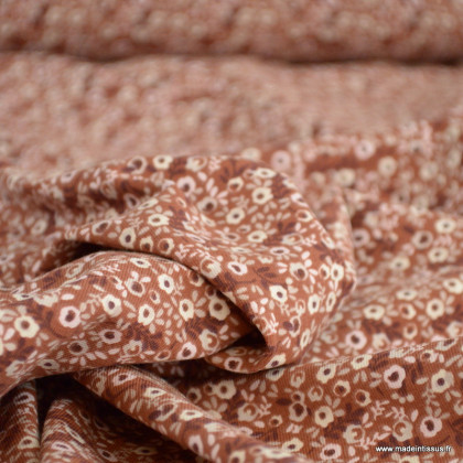 Tissu jersey motif petites fleurs roses fond brique - Oeko tex standard 100