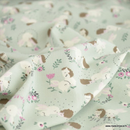 Tissu jersey motif hérissons, lapins et fleurs fond menthe - Oeko tex standard 100