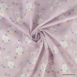 Tissu Coton Tamina motif lapins et fleurs fond parme - oeko tex