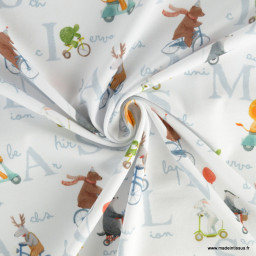 Tissu jersey motif animaux faisant du vélo fond blanc